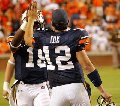Brandon Cox hi-fives Kodi Burns